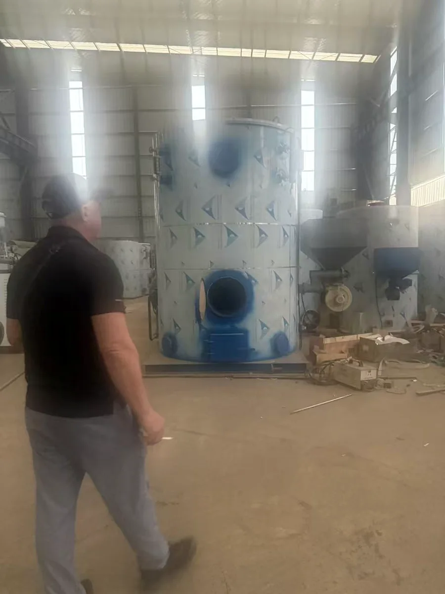 An international customer walking through the Anton Boiler manufacturing workshop in Henan China